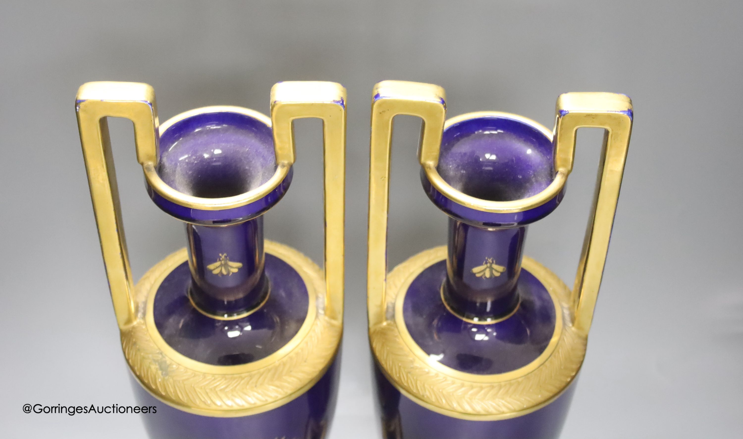 A pair of French gilt blue porcelain two handled vases, height 45cm